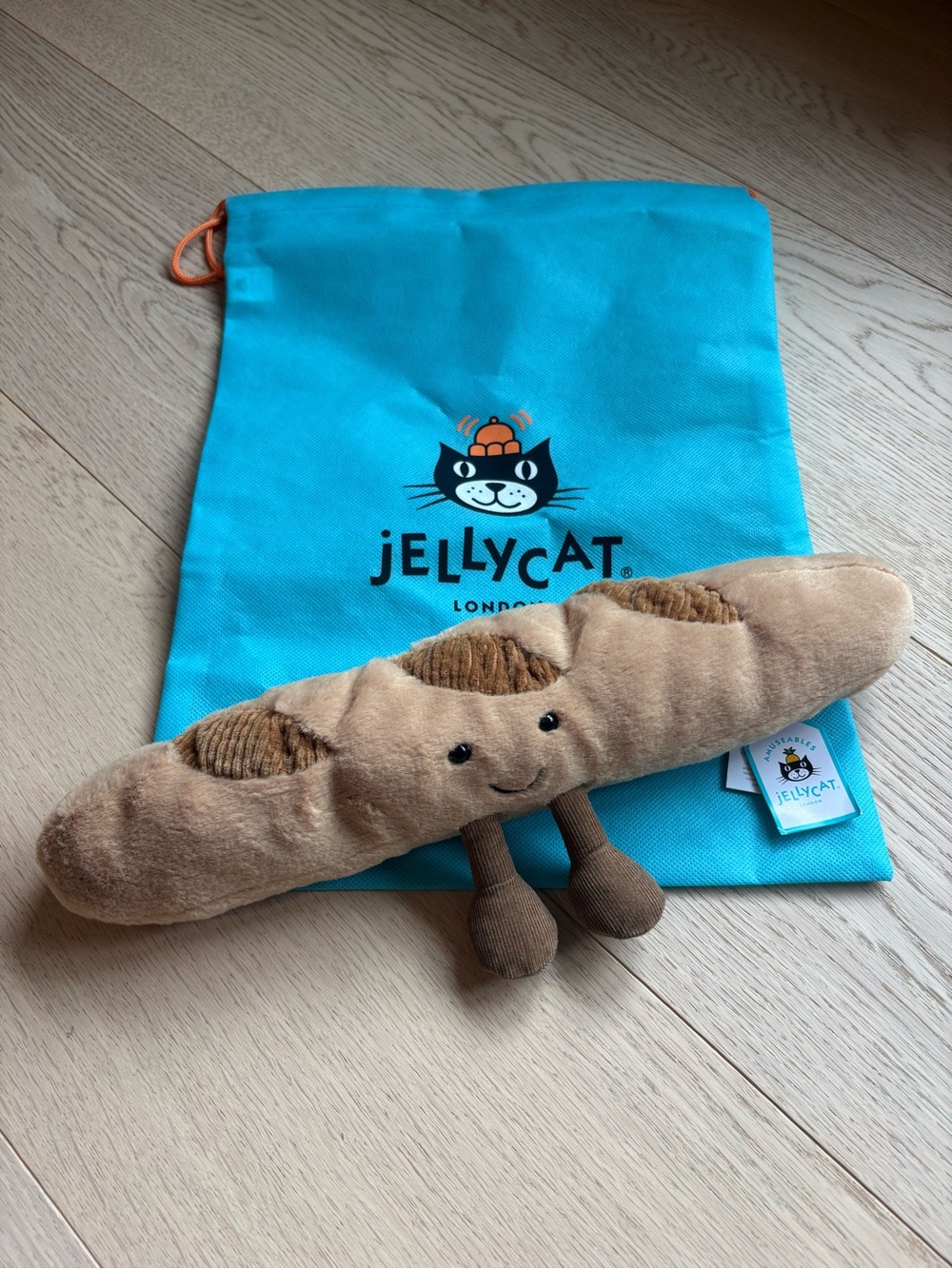 Jellycat Brown Plush Baguette with Turquoise Drawstring Pouch